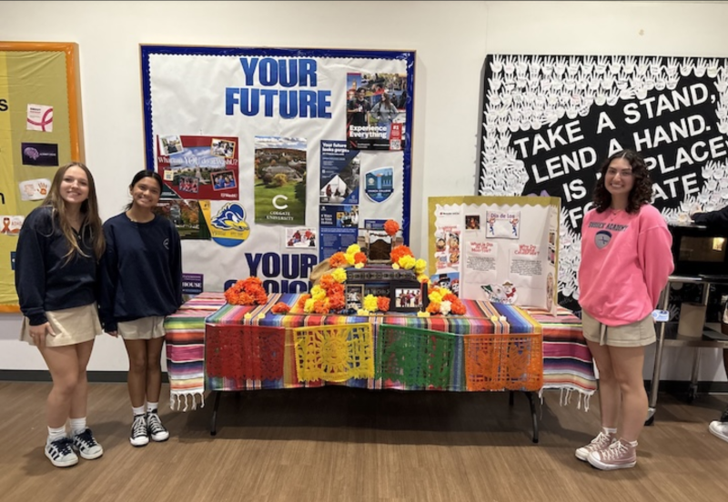 Sussex Academy World Language Honor Society members (l-r) Leni Kuska, Priya Haldar and Karina Lopez display the ofrenda they created to observe the Day of the Dead. SUBMITTED PHOTOS